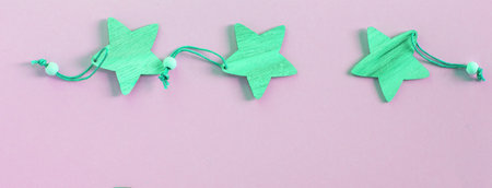 Christmas banner with three green wooden stars, decoration for the holiday in a rustic vintage style...