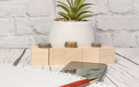 Stock market, coins, calculator, notepad, pen, and smartphone and financial chart. Abstract Business backgroundの写真素材