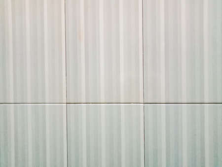 Close up of a white and grey corrugated iron wall.の写真素材