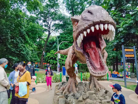 Bandung, West Java, Indonesia - Sunday, October 10, 2021: a dinosaur statue at an elderly park in Bandung, Indonesia.のeditorial素材