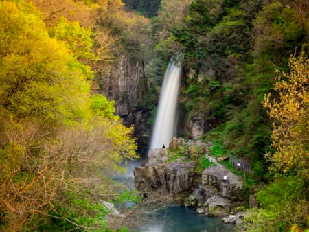 view of waterfalls, maple leaves and mountains in Japan.の写真素材