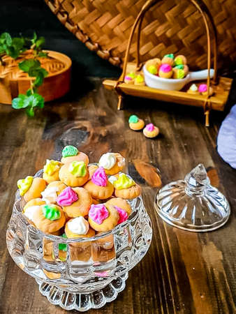 Easter cakes in the form of eggs on a wooden table.