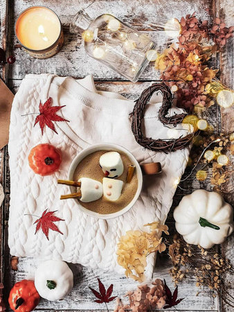 Autumn composition with leaves and cup of coffee, cake, pumpkin, book, on white background.  Still life concept.の写真素材