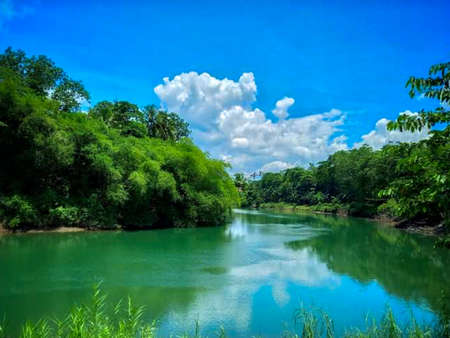 Beautiful view of the river with blue sky and white clouds.