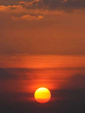 the beauty of the orange sunset looks over the beach.の写真素材
