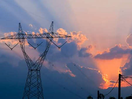 the beauty of the orange sunset behind the electric pole.の写真素材