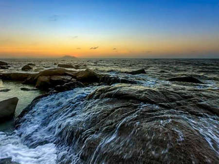 the beauty of the panorama of the sunset landscape on the coast of Indonesia.