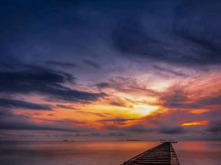 the beauty of the orange sunset in Indonesiaの写真素材