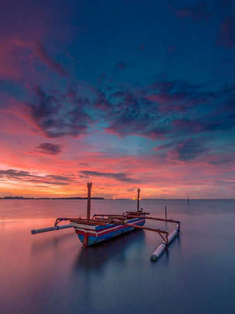 the beauty of the orange sunset in Indonesiaの写真素材