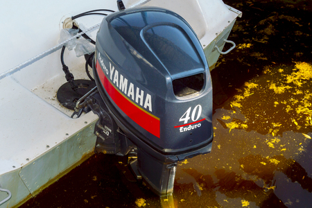 Outboard motor Yamaha Enduro 40 on a white boat, released into the water. Surgut, Russia, July 02,...