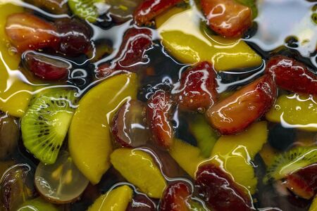 Multi-colored jelly with slices of natural fruits. Close up. View from above.の写真素材