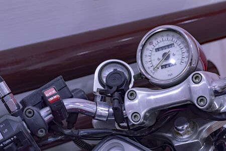 Motorcycle steering wheel, speedometer and switches. Close up. Top side view.の写真素材