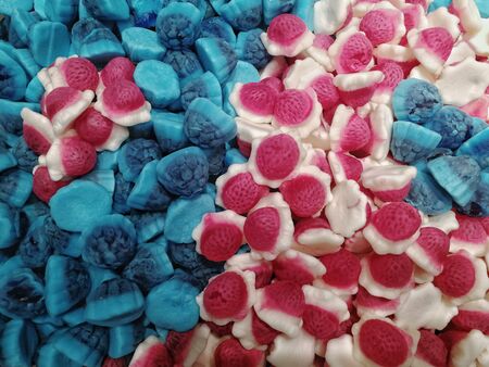 Multi-colored chewing candies in bulk. Top view.