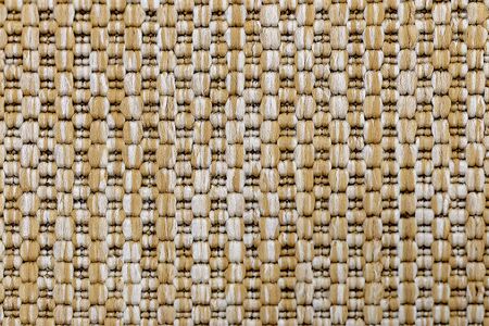 A knitted beige textile background. Copy space.