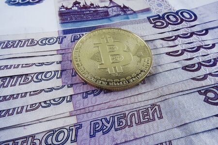Russian paper money and bitcoin. Top view