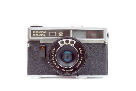 Old film camera ZENIT on white background. Front view.