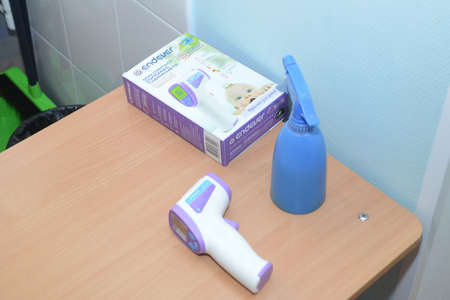 Contactless thermometer. An antiseptic. Surgut, Russia - September 1, 2020