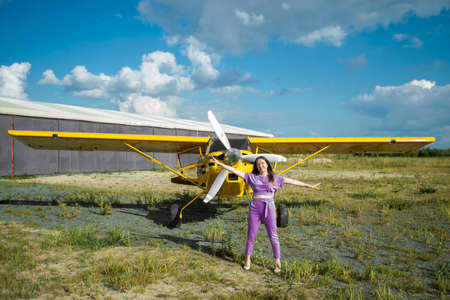 Woman in background of plane. Super good warm autumn day.