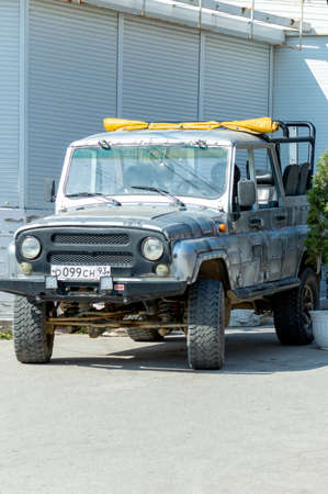 SUV UAS Hunter convertible for excursions through the mountains. Sunny autumn day. Crimea, Sudak - 10 October 2020.のeditorial素材