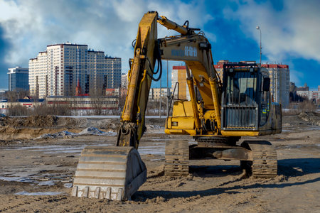 Yellow excavator or Bulldozers in town. Surgut, Russia - 20 April, 2021