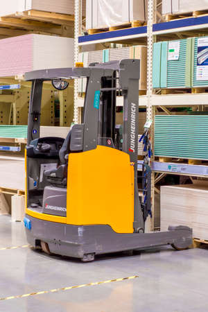 Eectric loader in supermarket. Side view, indoors horizontal shot. Surgut, Russia - 16 April 2021のeditorial素材
