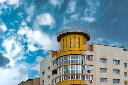 It's a beautiful, unusual modern building aganist blue clouds sky. Surgut, Russia - 17, May 2021.のeditorial素材