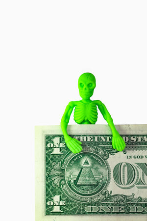 A green skeleton for a dollar billの写真素材