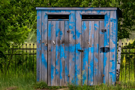 Village wooden toilet. Outdoors, day light front view.の写真素材