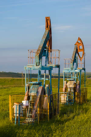 Working oil pump from oil field. Industrial equipment. Industrial equipment. Bashkortostan, Russia - June 12, 2021.のeditorial素材