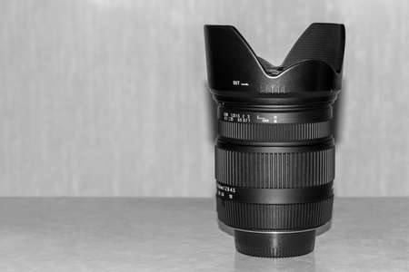 Photo lens with lens hood. Space for text.