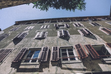 View up to the building with open windows