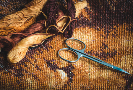 Set for embroidery, finished work, cross-stitch , photo in low light