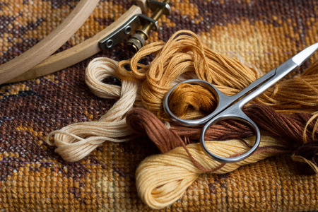 Set for embroidery, finished work, cross-stitch , photo in low lightの写真素材