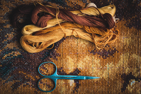 Set for embroidery, finished work, cross-stitch , photo in low lightの写真素材