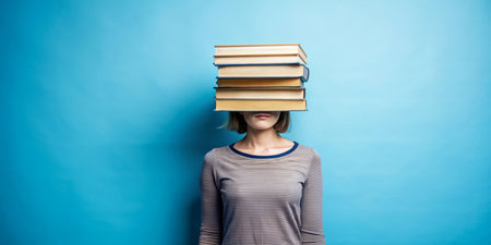 A woman with books instead of her head. A concept of a very clever person. Knowledge is strength.の素材