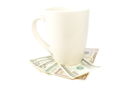 Cup with money isolated on white backgroundの写真素材