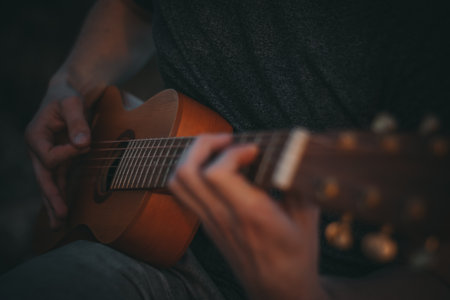 The man plays the guitar, closeの写真素材