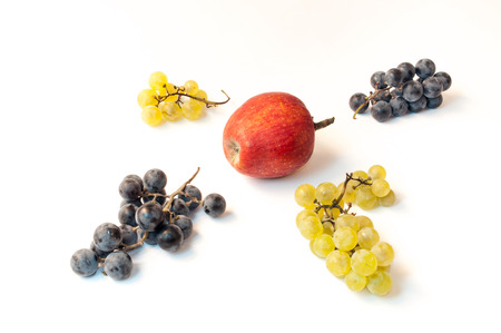 Still life with apples and grapes on a white backgroundの写真素材
