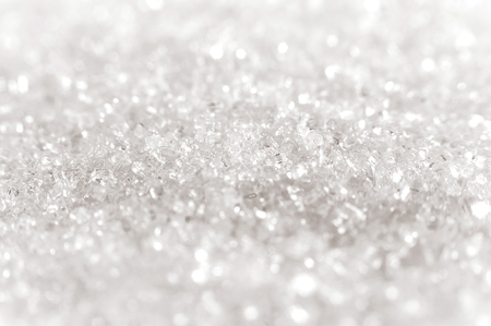 White sugar crystals close up with a blurred backgroundの写真素材