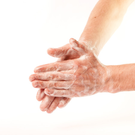 Hands in the foam on white background (isolated)