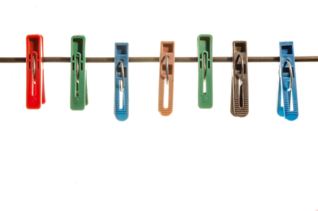 Colored pegs for clothes on the rope .の写真素材