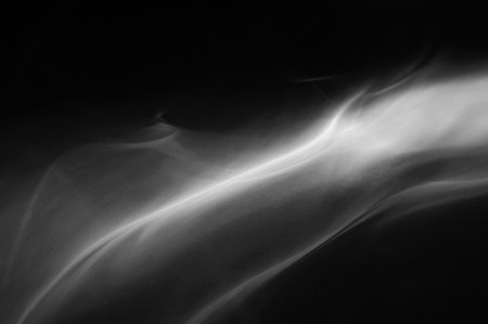 Movement of smoke,Abstract white smoke on black background .の写真素材