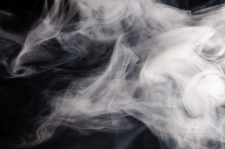 Movement of smoke,Abstract white smoke on black background .の写真素材