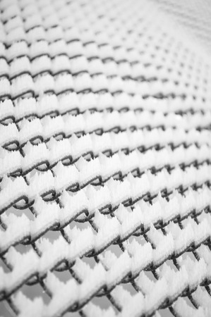 Lattice fence covered with snow. Winter time. Abstract background .の写真素材