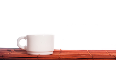 White crockery on a bamboo Mat .の写真素材