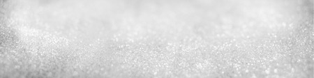 Abstract of Bright and sparkling bokeh background. silver and diamond dust bokeh blurred lighting from glitter texture.の写真素材