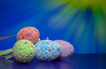 Easter eggs are decorated with decorative shiny glitter.の写真素材