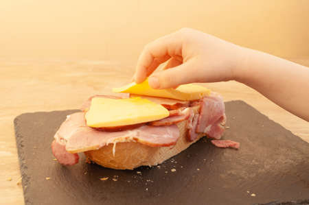 Hand children's makes a sandwich.の写真素材