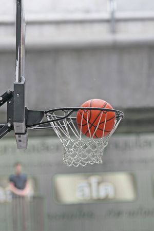 Close up of basketball in hoop