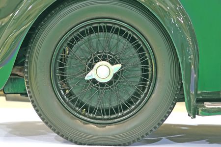 Close up of the wheel of an old classic car